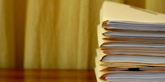 Stack of books representing knowledge and experience